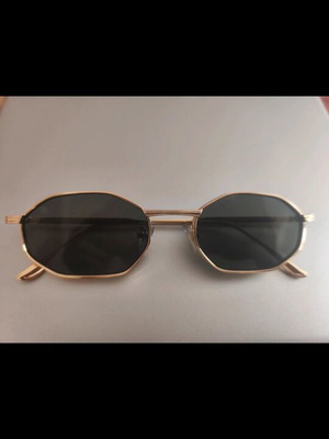 Red Raven sunglasses with gold frame, black lenses