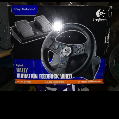 PlayStation 2 used with 7 games, 3 memory cards, 2 controllers and steering wheel pack