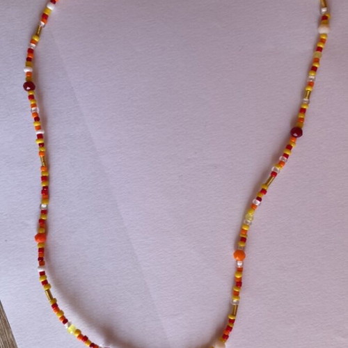 Handmade necklace colorful in red, orange and yellow