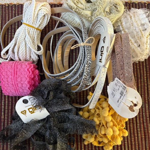 Decorative ribbons, cords, lace and craft elements like new