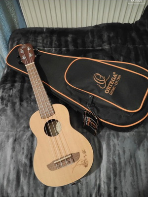 Ukulele new with case and tags, tuned