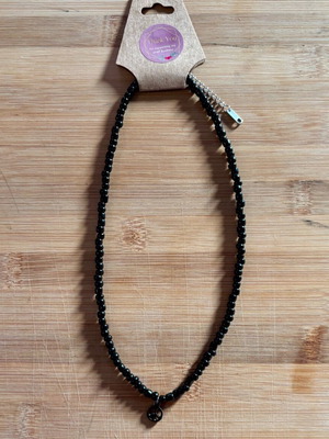 Necklace with black beads and peace symbol like new