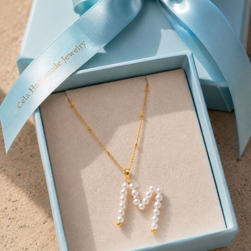 Pearl monogram necklace with stainless steel chain, letter M