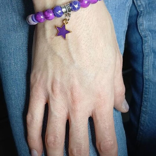 Handmade bracelet with purple and pink beads and golden purple star