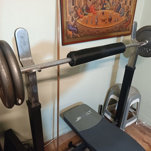 Weight bench with bar and weights used, iron