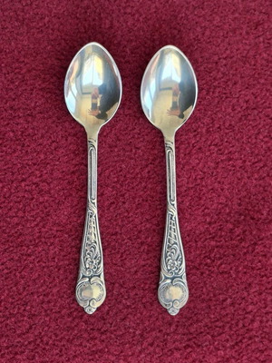Pair of 800 silver spoons used with decorative baroque handles