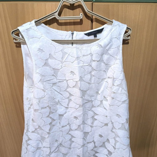 White sleeveless blouse used with stain on chest size M