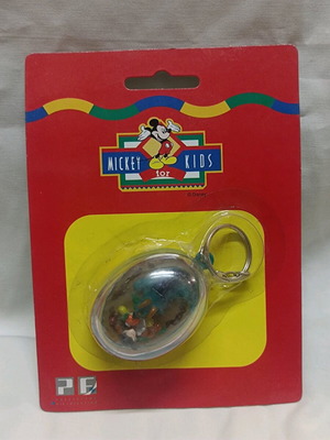 Mickey Mouse/Dinosaurs Moving Keychain like new from Mickey Kids