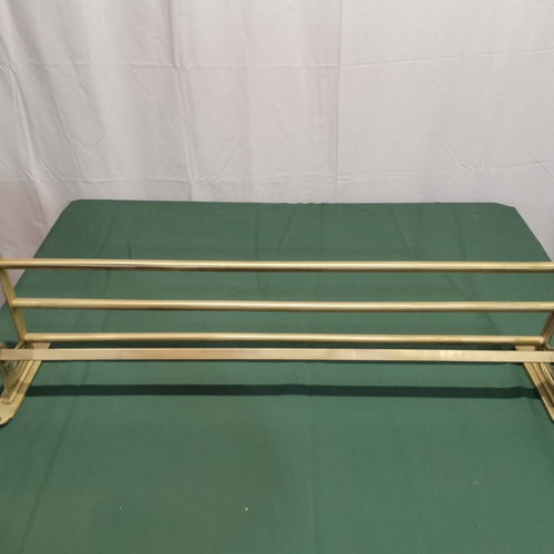 Brass wall-mounted hanger used