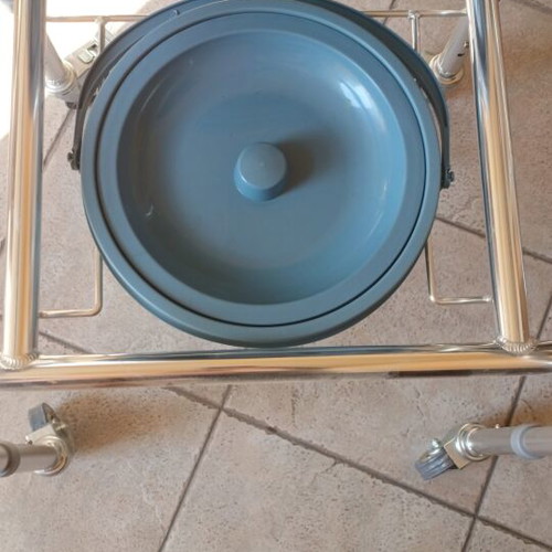 Folding commode chair with wheels