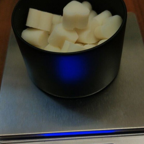 Wax melts in black matte metal container with choice of scent