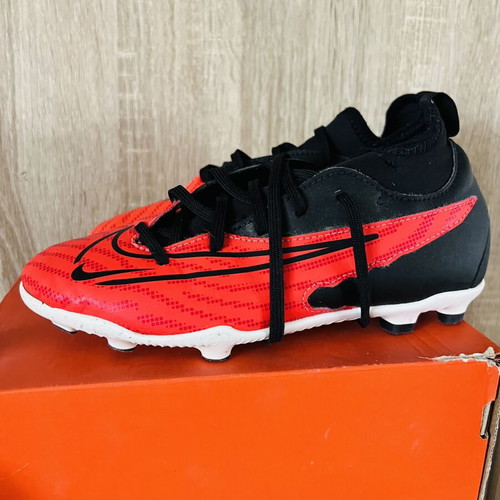 Nike football shoes like new, sizes 22 and 35, black and red