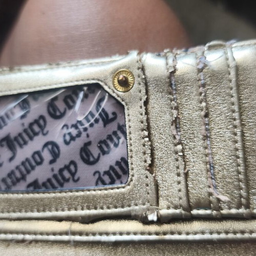 Juicy Couture red wallet used with side wear on gold details