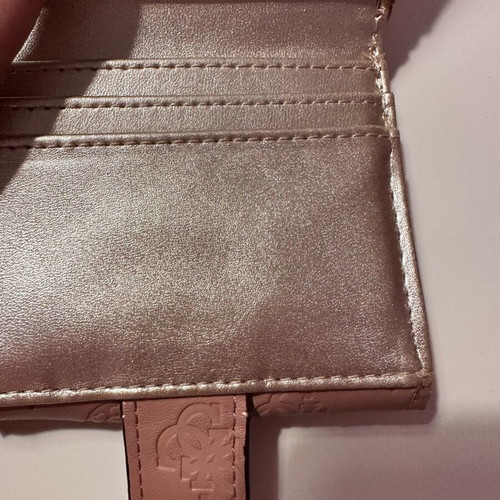 Guess wallet used, small size, pink with many compartments