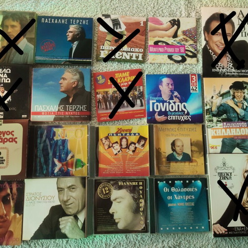 Collection of 22 Greek and international music CDs in 13 cases