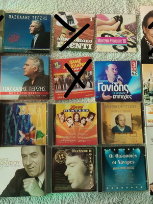 Collection of 22 Greek and international music CDs in 13 cases