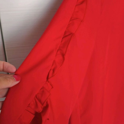 Women's red blouse with ruffles like new, size L