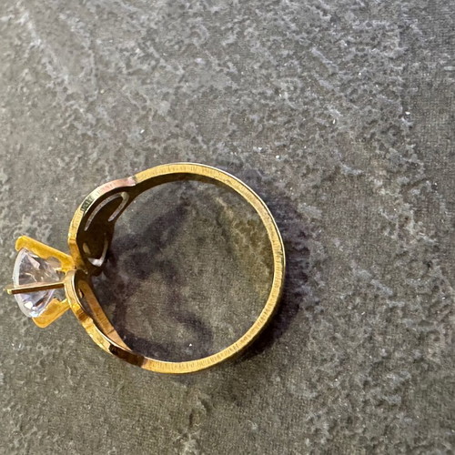 Gold-colored ring used with heart design and zircon stone