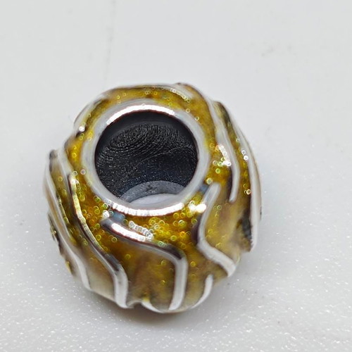 Silver charm bead with gold glitter enamel spiral design like new