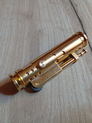 Vintage brass lighter used with unique ignition mechanism