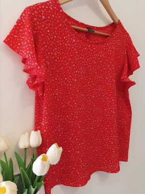 Floral top red like new with ruffles on sleeves