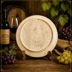 Old wall plate with wine cellar and barrel theme, possibly German