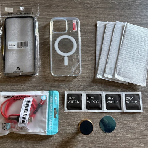iPhone 15 Pro Max pack like new with cases, screen protectors, stand and cable