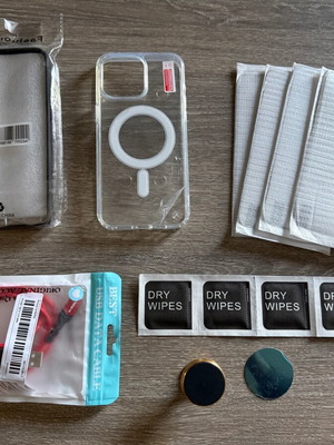 iPhone 15 Pro Max pack like new with cases, screen protectors, stand and cable