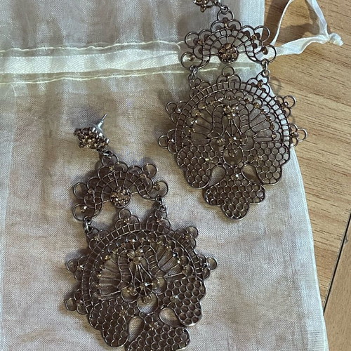 Long gold-plated earrings used with bronze-tone rhinestones