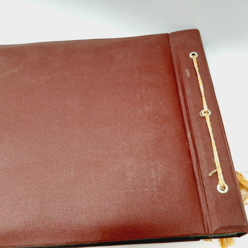 Vintage photo album with brown embossed fabric and embroidery, 35 leaves