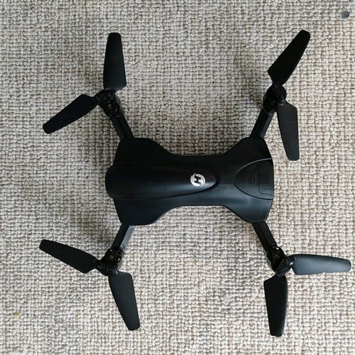 Holy Stone drone used with remote control and spare propellers