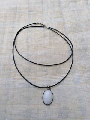 Handmade pendant with white nephrite and steel cabochon