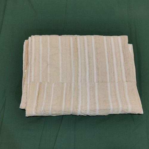 Woven bed sheet used with stain and wear from 1930 era