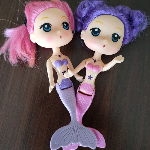 Dolls used, two regular and two mermaid dolls