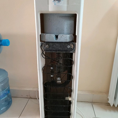 Water cooler used with 6 bottles for cold and hot water