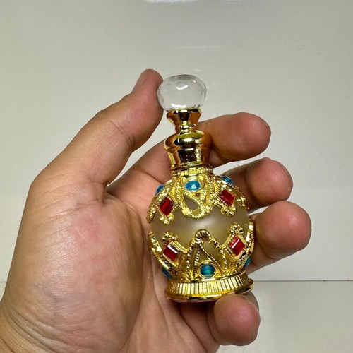 Vintage Arabic perfume bottle with gold metal frame and stones