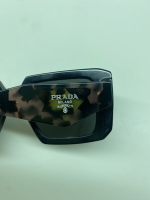 Prada sunglasses like new, black with animal print arms