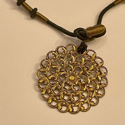 Necklace with gold-colored pendant like new