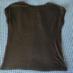 Black blouse with subtle chest design, size Large/Extra Large