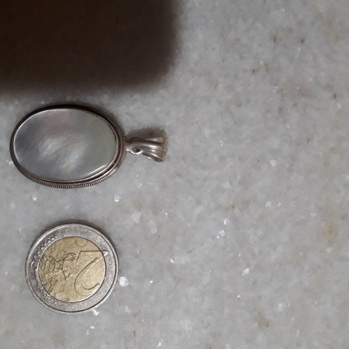 Silver pendant used with hallmark