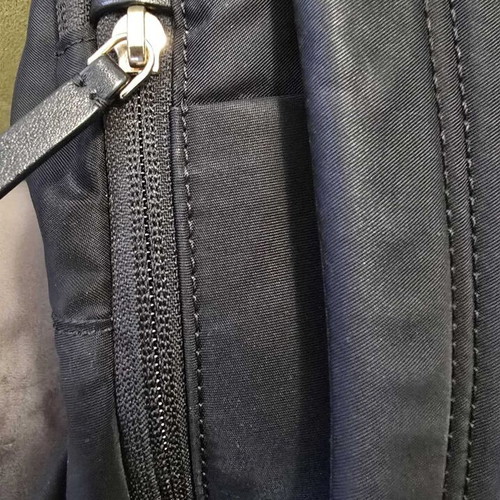 Tumi backpack used, black with gold details