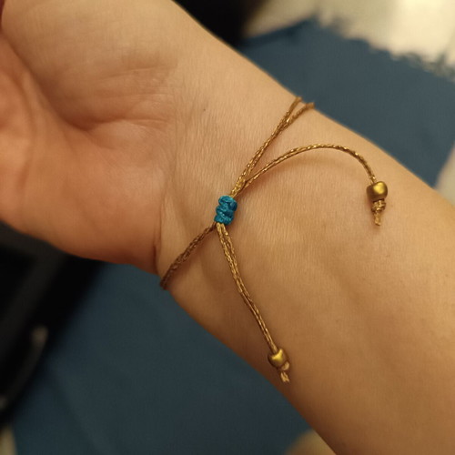 Macrame feather bracelet with adjustable clasp