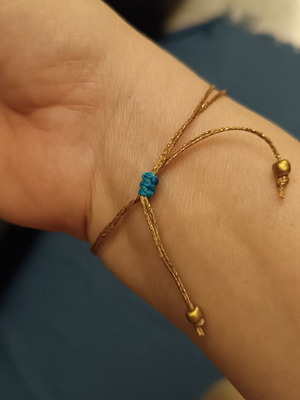 Macrame feather bracelet with adjustable clasp