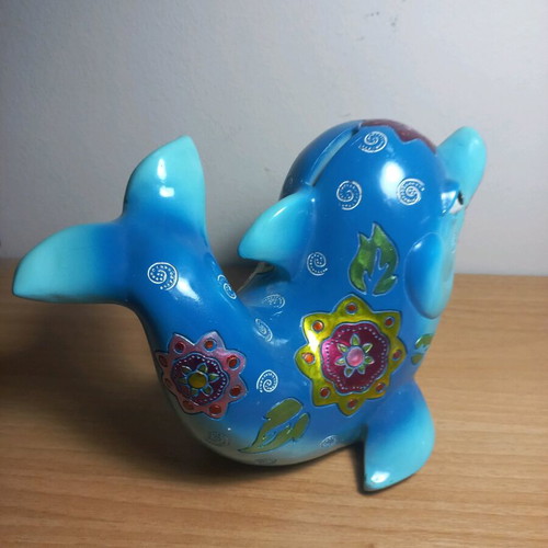 Dolphin piggy bank with designs like new