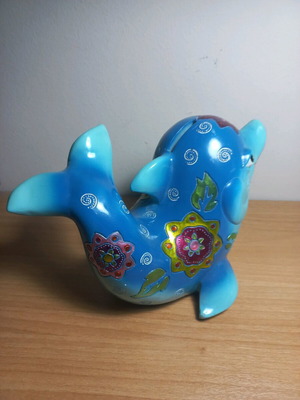 Dolphin piggy bank with designs like new
