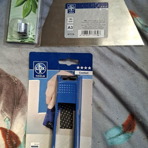 Tool set with faucet adapter, wood planer and tile spatula