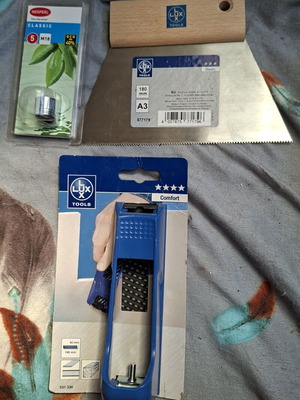 Tool set with faucet adapter, wood planer and tile spatula
