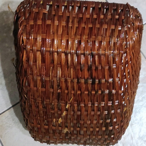 Two woven baskets in red and brown