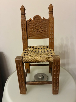Decorative handmade carved chair with wicker like new