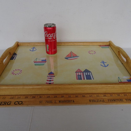 Vintage wooden breakfast tray with nautical theme used